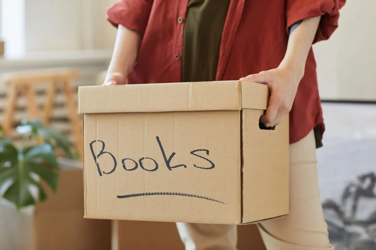 Person wrapping books for moving, TrekMovers