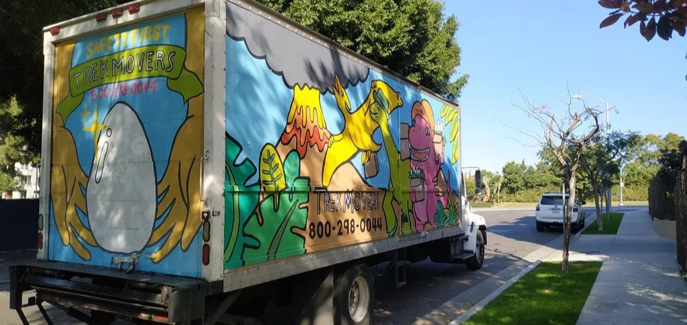 Professional Long-Distance Moving Company. Fully equipped painted moving truck by Trek Movers