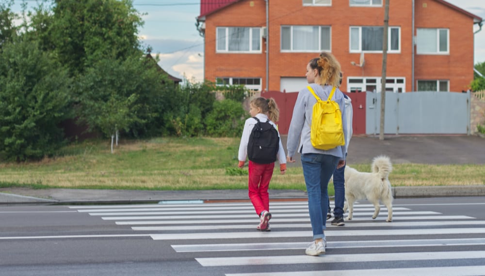 Couple walking in a peaceful small town neighborhood, TrekMovers