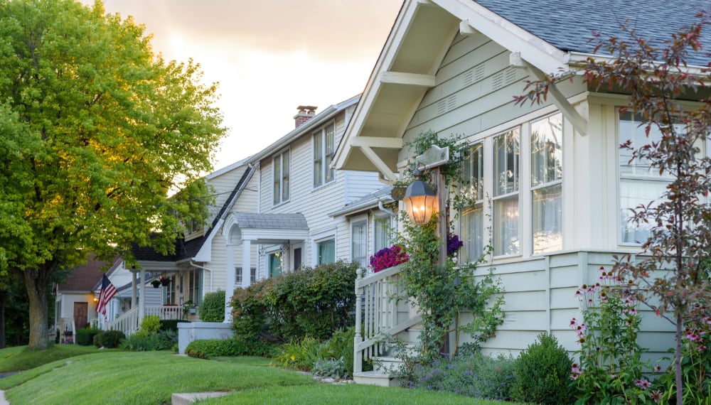 Quiet small town street with mountain views in the background, TrekMovers