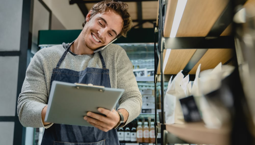 Moving to Small Towns Is the Next Big Thing in Post-Pandemic World smiling busy bartender checking goods while talkin 2022 07 06 18 51 29 utc