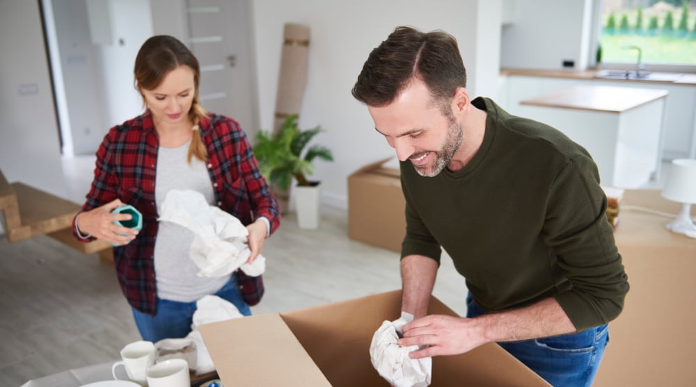 How to Pack for a Move — A Complete Guide couple moving house packing their belongings 2022 03 08 01 03 03 utc