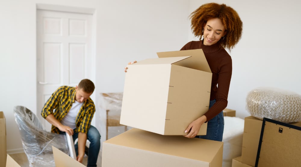 How to Pack for a Move — A Complete Guide happy couple packing beginnings before home moving 2022 02 18 04 30 48 utc