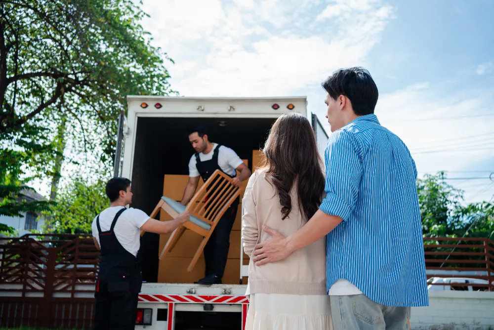 What to do when you are moving into a new house asian couple check while unloading boxes and furni 2026 01 07 23 33 22 utc