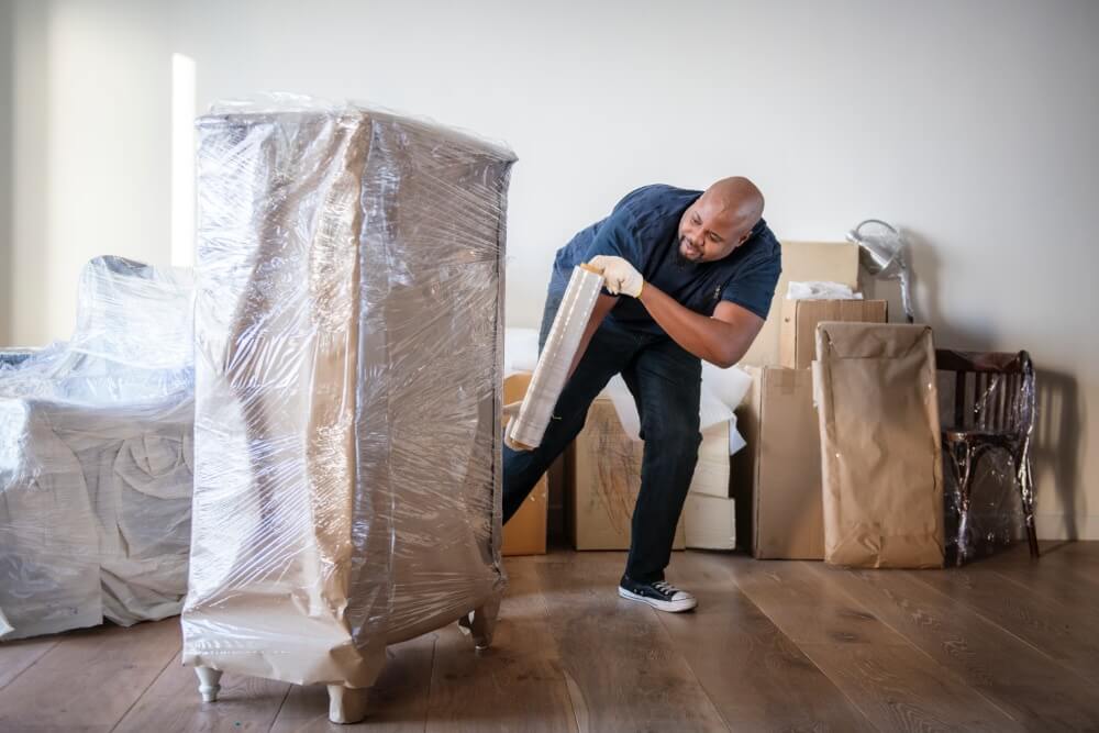 Furniture Moving Tips — A Comprehensive Guide black man moving furniture 2023 11 27 05 03 29 utc