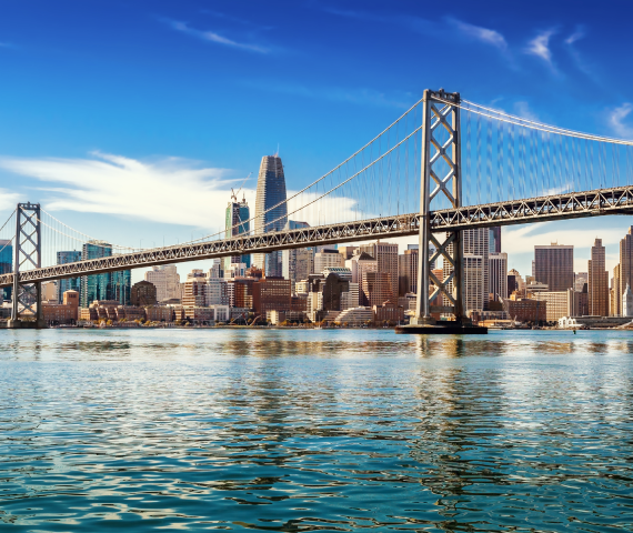 Aerial view of downtown San Francisco and the Oakland Bay Bridge on a sunny day in California.