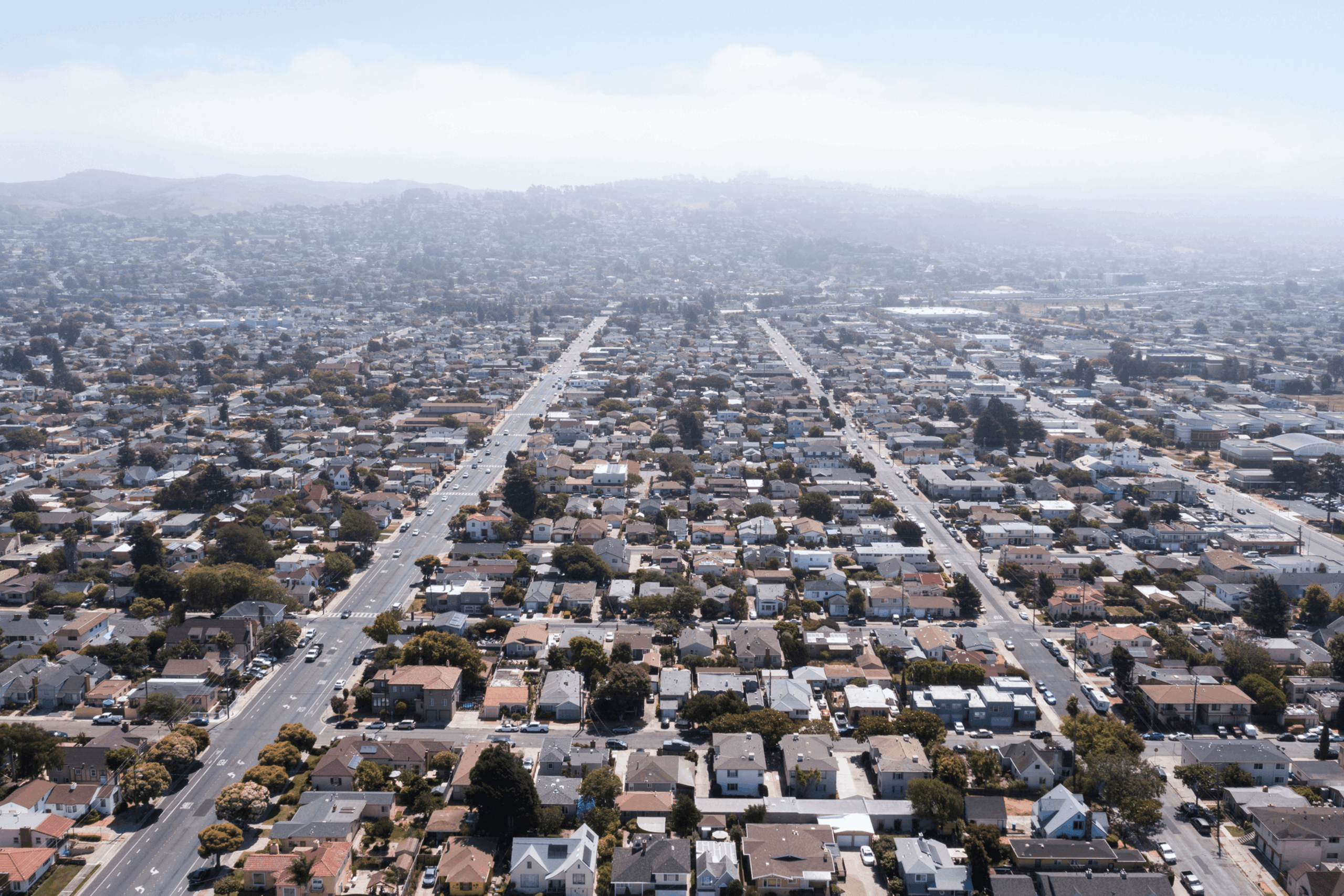 Daytime aerial view of dense residential sprawl in the Bay Area city of Richmond, California, USA.