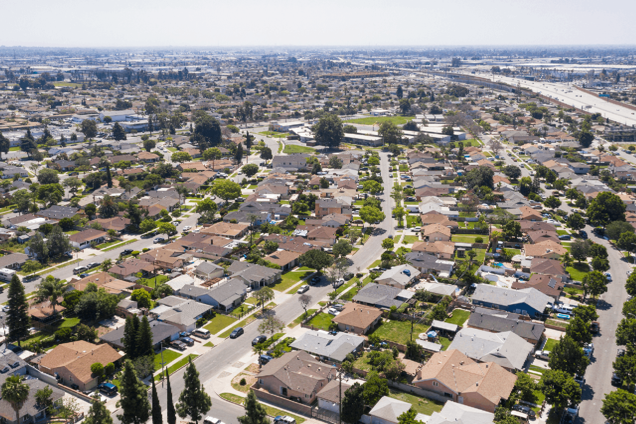 Daytime aerial view of a suburban neighborhood in Norwalk, California.
