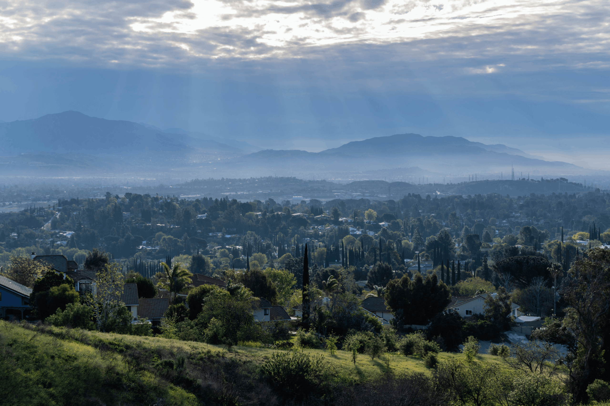 Morning sunbeams and storm clouds above the San Fernando Valley area of Los Angeles in Southern California.