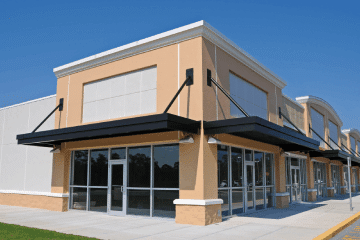 A shopping center featuring empty retail and office spaces.