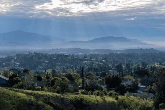 Morning sunbeams and storm clouds above the San Fernando Valley area of Los Angeles in Southern California.
